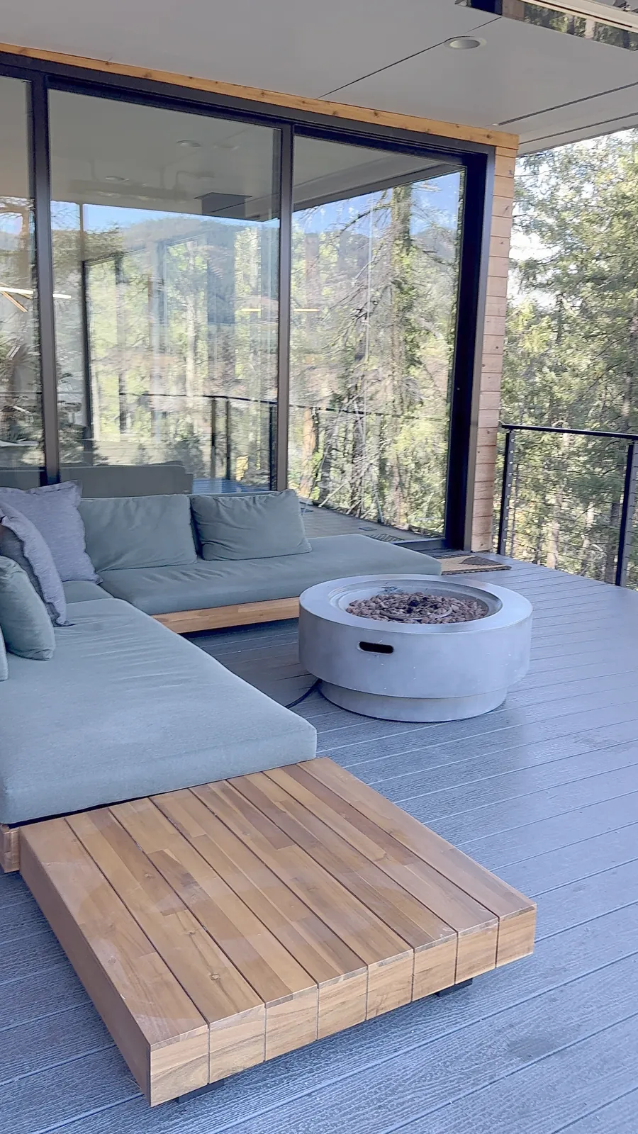 Wooden deck with railings and outdoor chairs