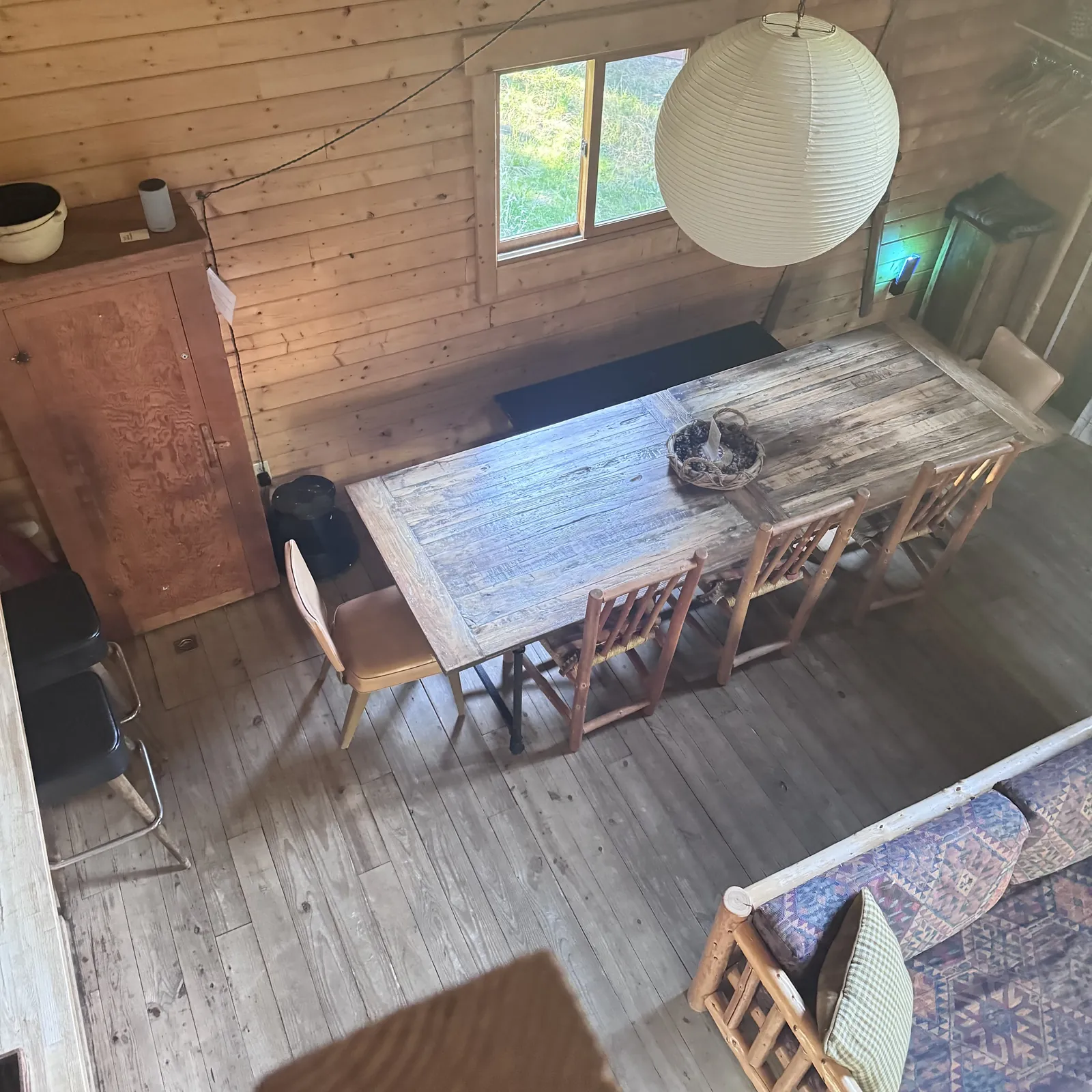 Dining area with a table, chairs and a hanging light