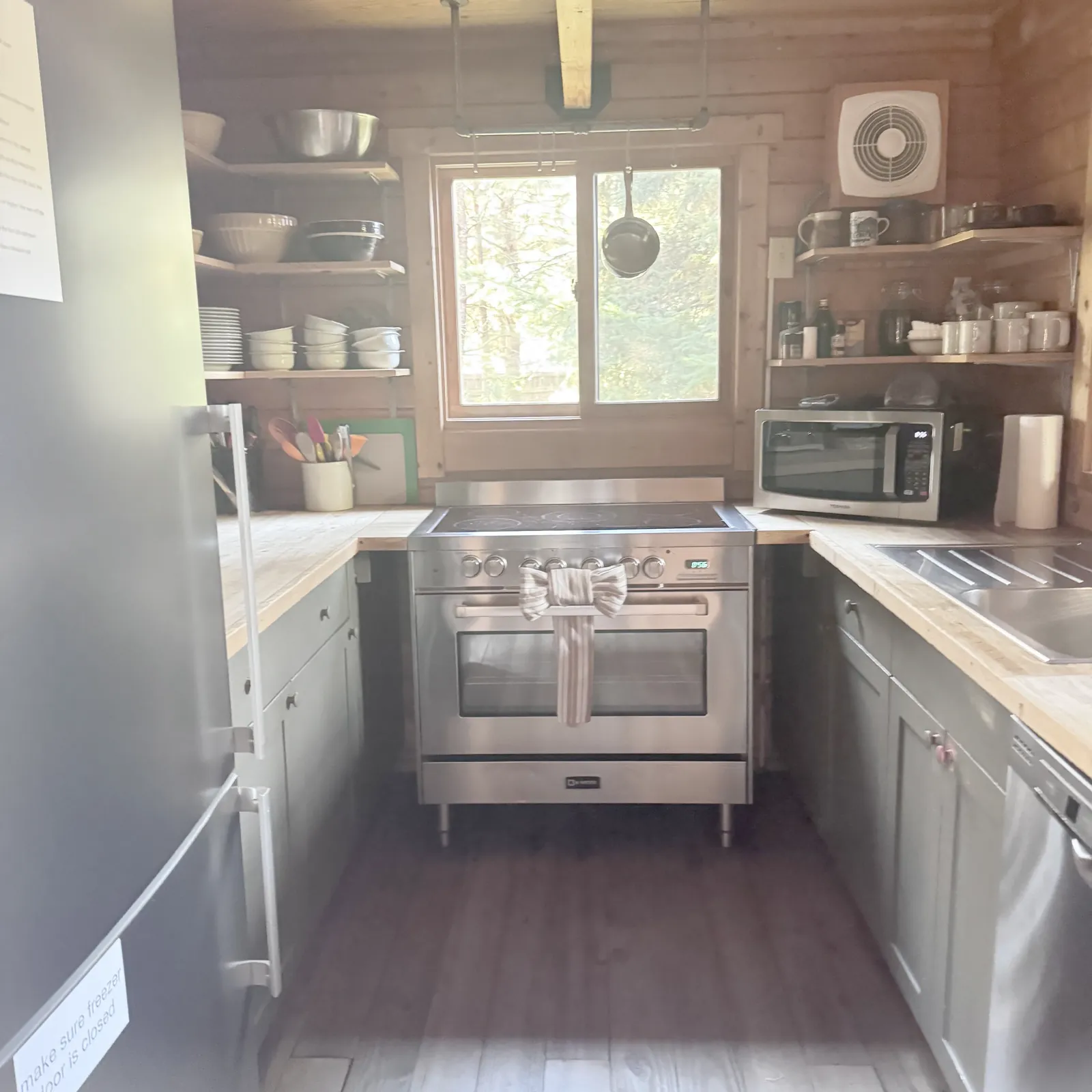 Kitchen with cabinets, appliances and clear counters