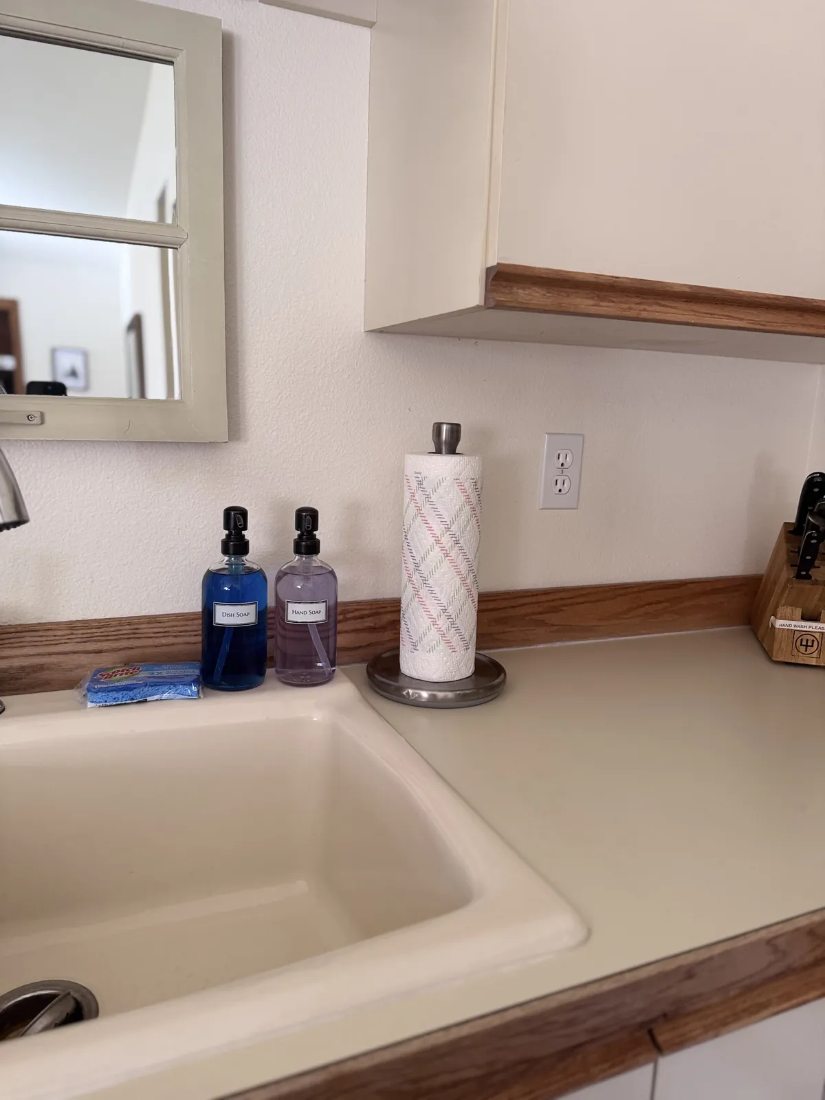Kitchen with cabinets, appliances and clear counters